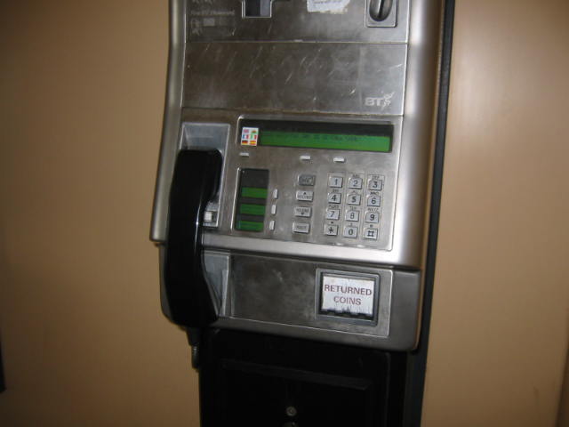 a silver pay phone with two ons on top