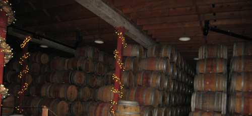 a barrel storage area with many different types of wine in it