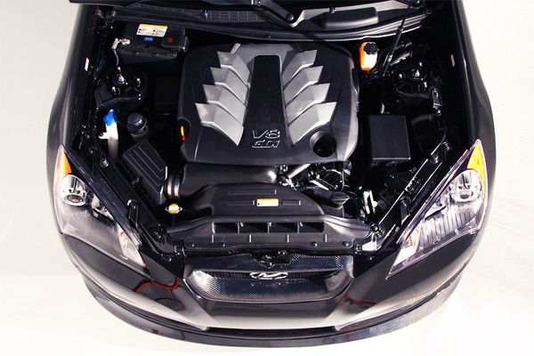 the engine compartment of a car with its hood opened