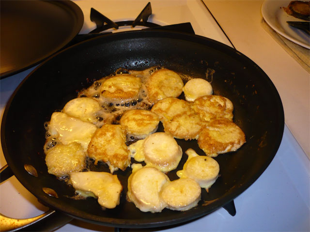 a pan with some fried food cooking in it