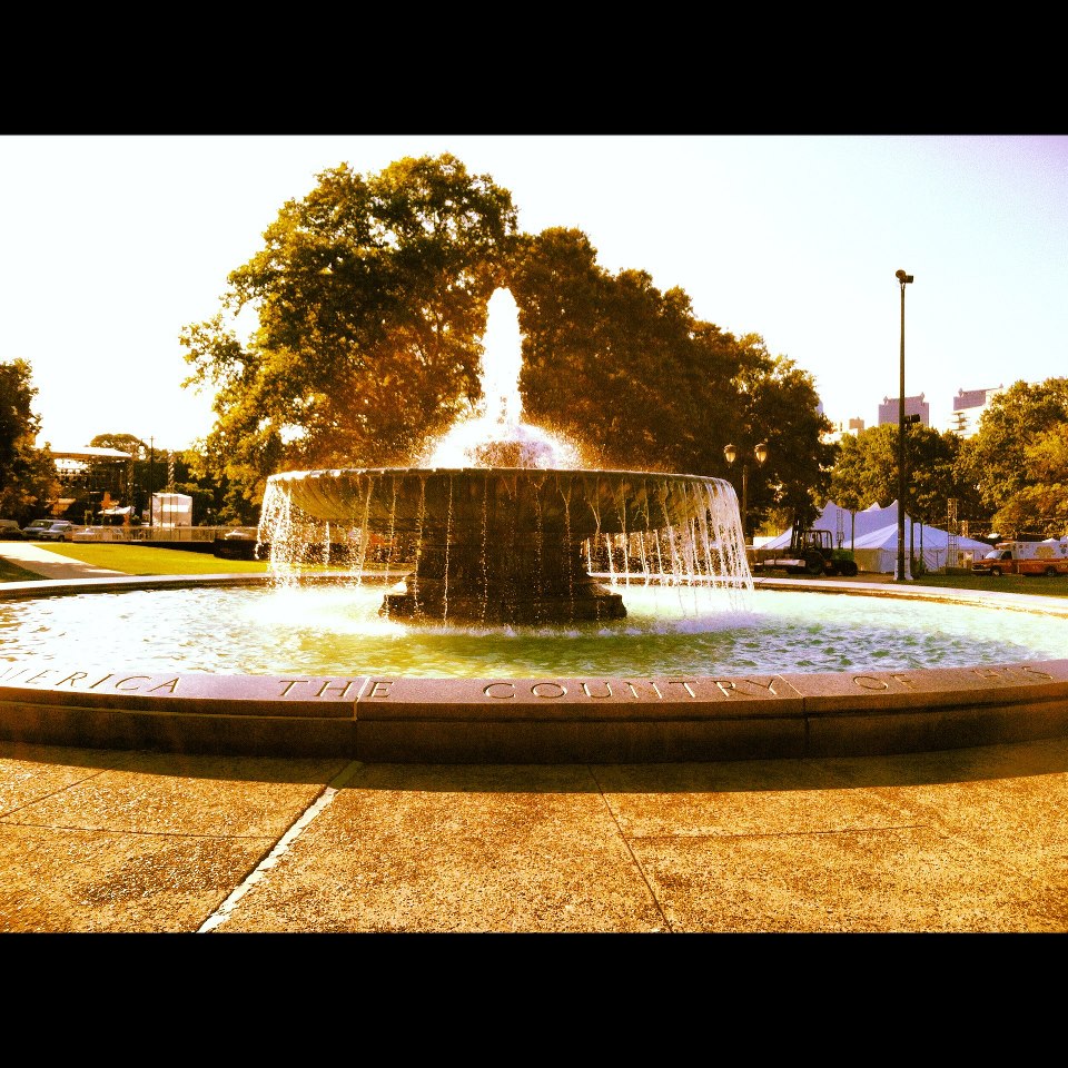 the fountain on the edge of the park is sparkling