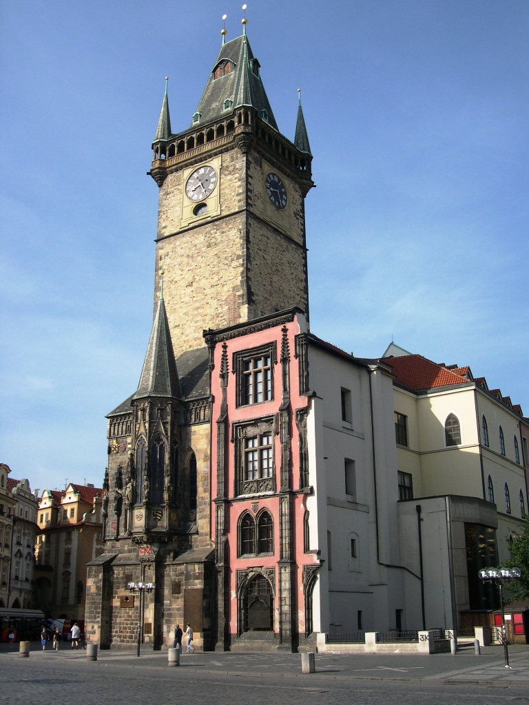 a building with a tower with a clock displayed on the side