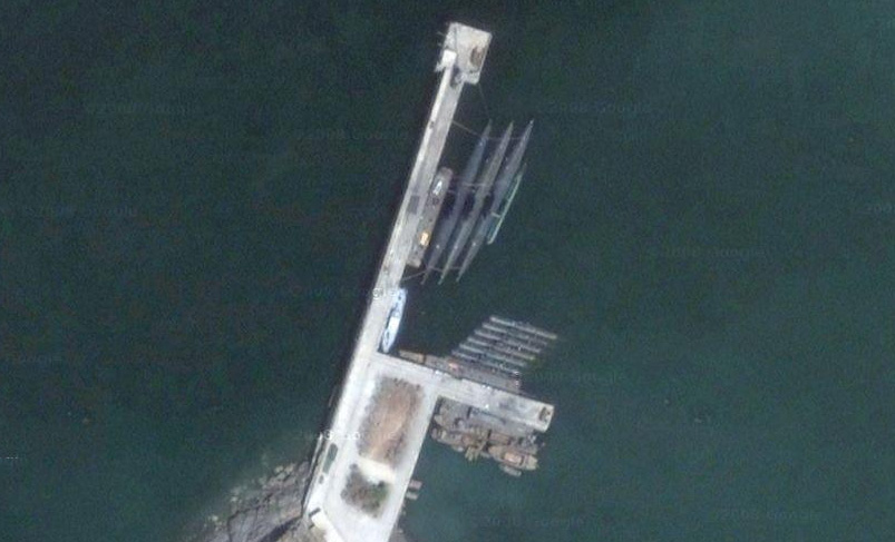 an aerial view of the floating dock in water
