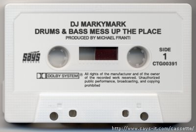 a white tape recorder with the words drm's & bass mess up the place printed on it