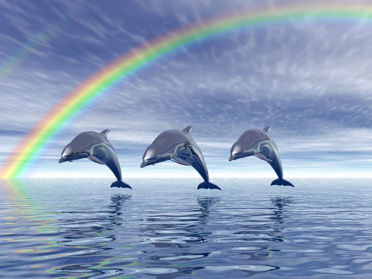the two dolphins swim across the water under a rainbow