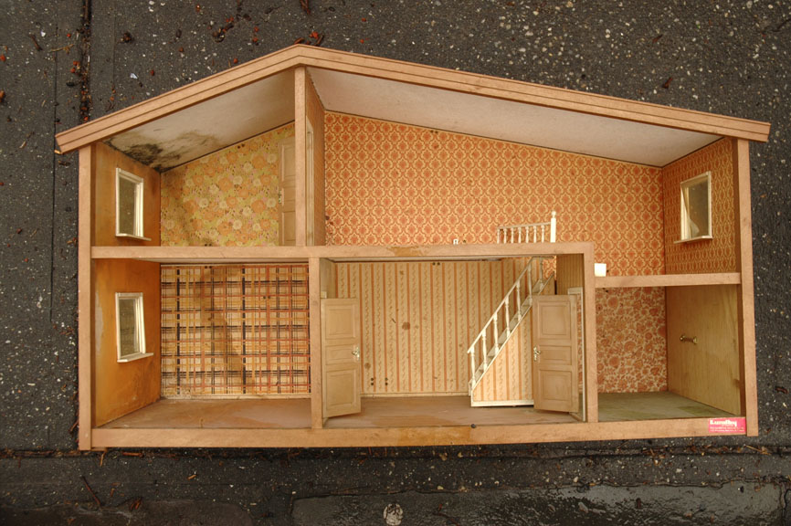 an inside doll house on display for scale