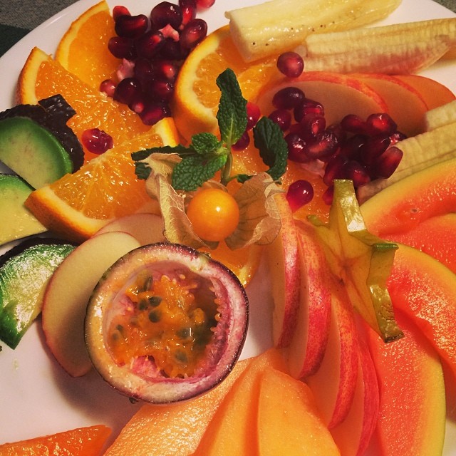 a plate with many different sliced fruit on it