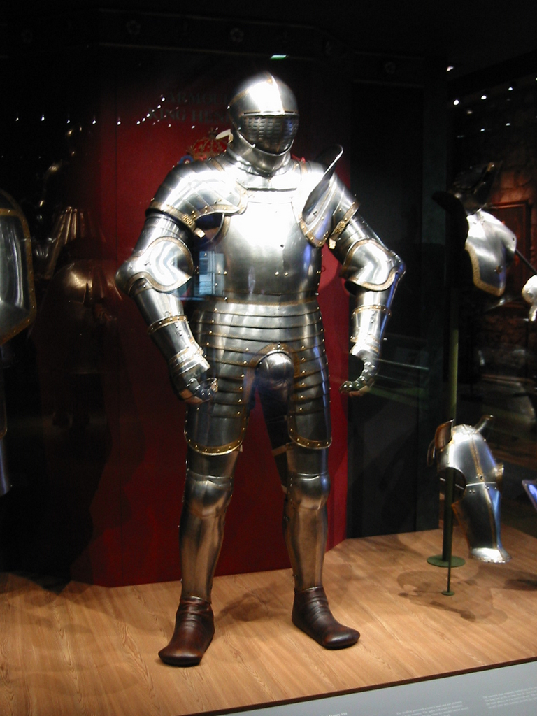 a knight like suit and helmet in an old style shop