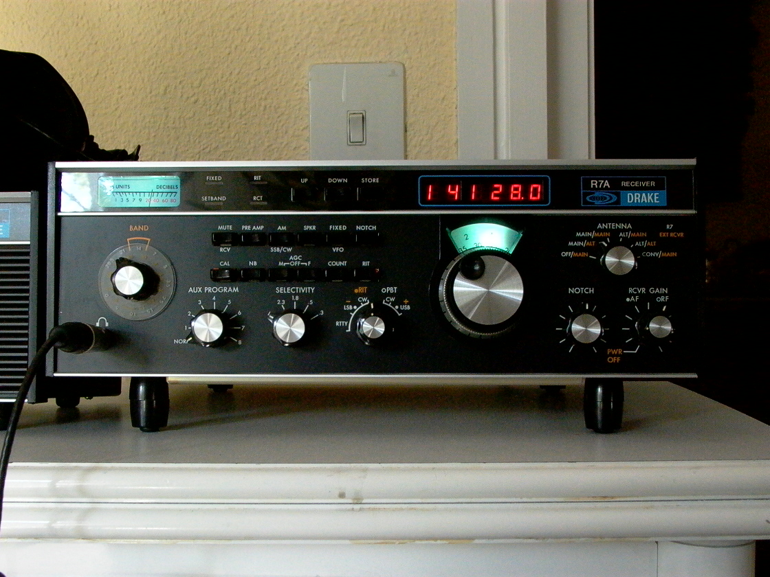an electronic radio sitting on top of a table
