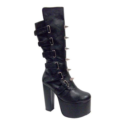 a pair of high heeled black boots with chains on the ankle