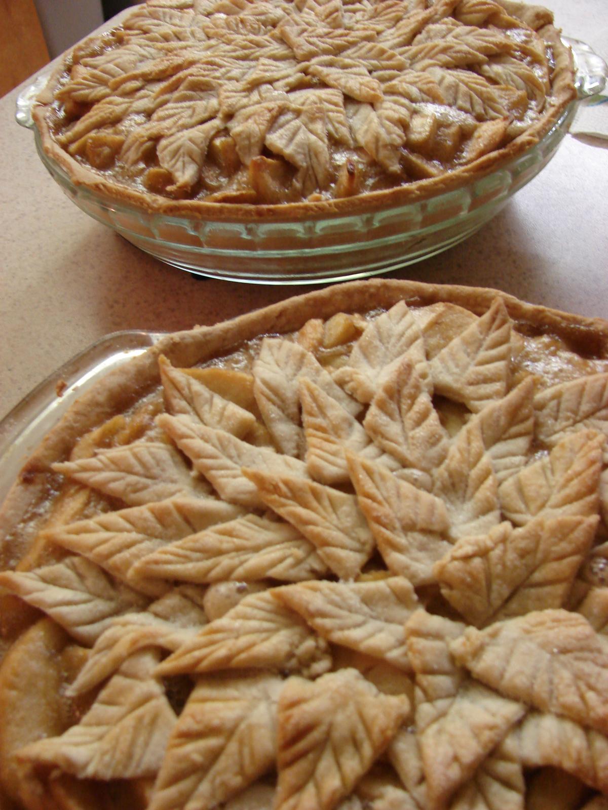 two pies sit on display on top of a table