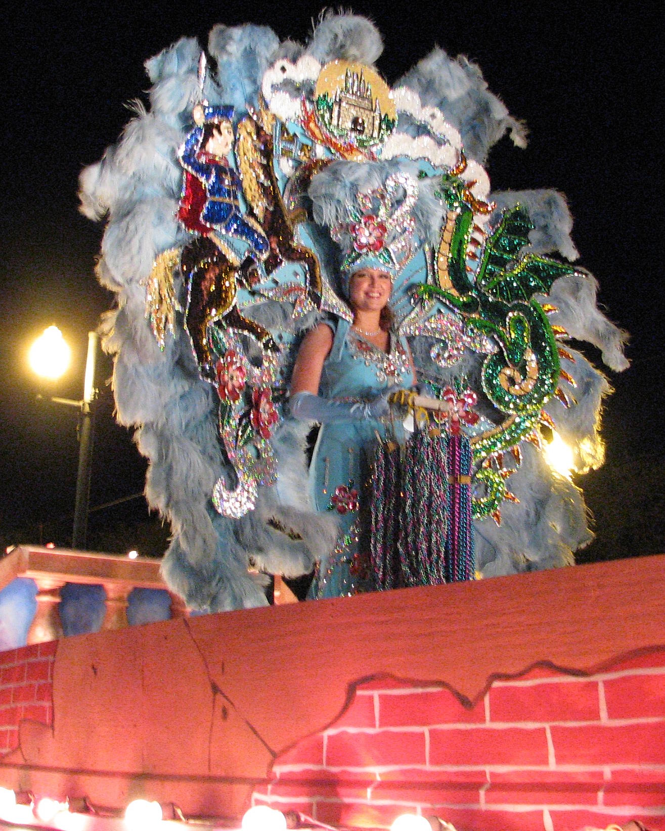 a woman standing on a float with decorations