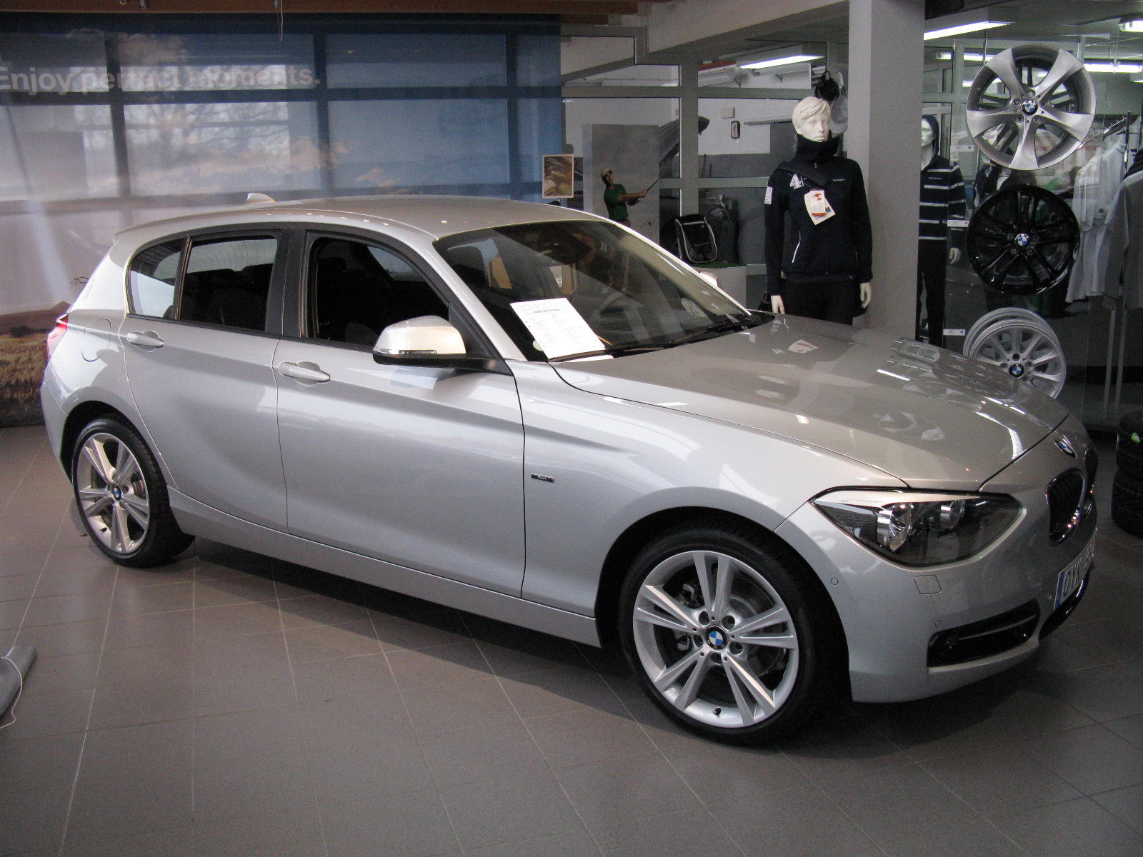 a grey car is parked in a garage