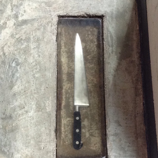 a knife that is stuck inside a box