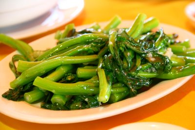 stir fry with green vegetables in a bowl