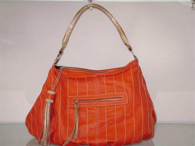 a purse with a long handle and zipper