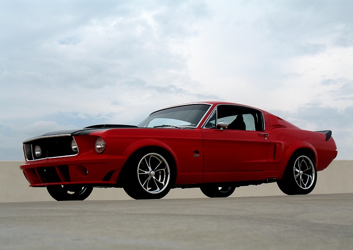 the front view of a red mustang sitting on a runway