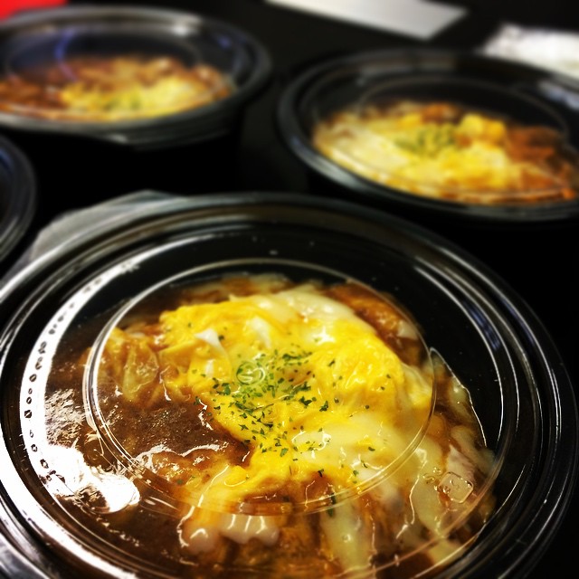 crock pot filled with soup on top of a stove