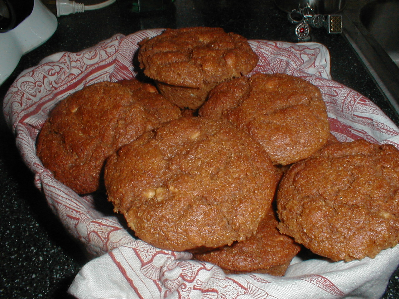cookies are in a glass bowl on a counter