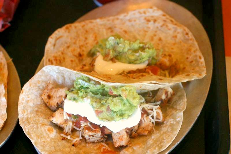 three burritos on a plate ready to be eaten