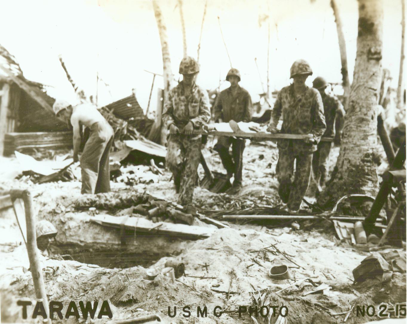 men in fatigues sitting around a table with an unknown object