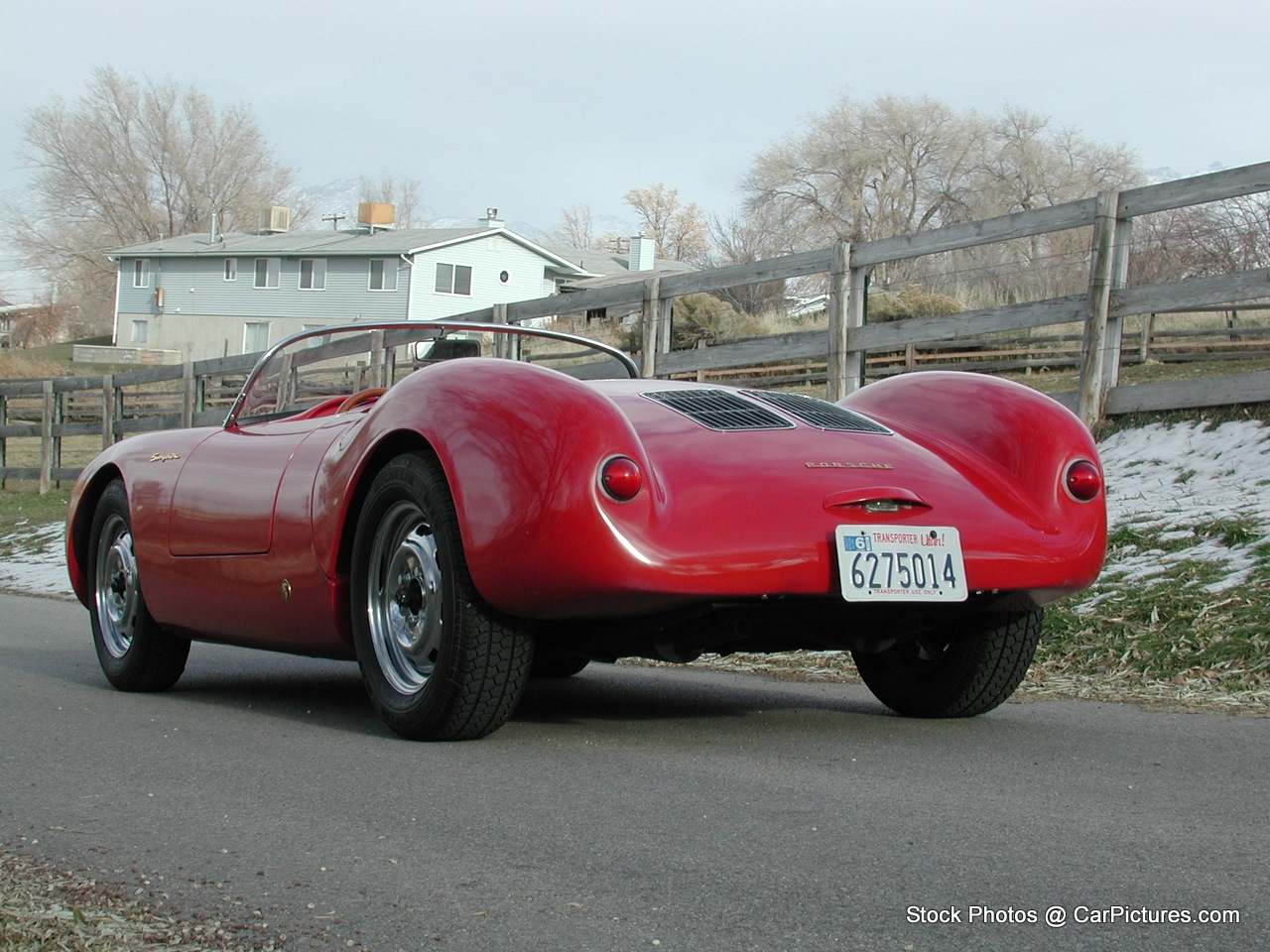 the classic sports car is painted red