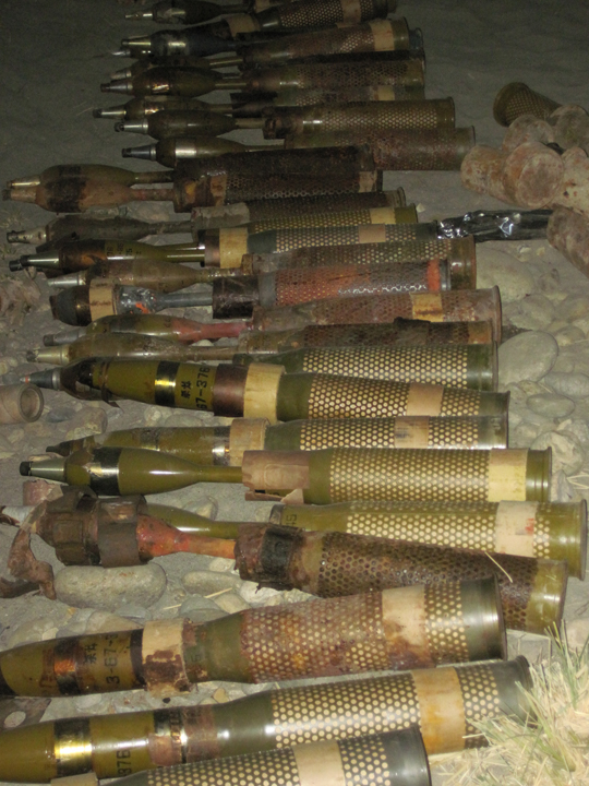 multiple bullet shells are shown lined up with several smaller ones