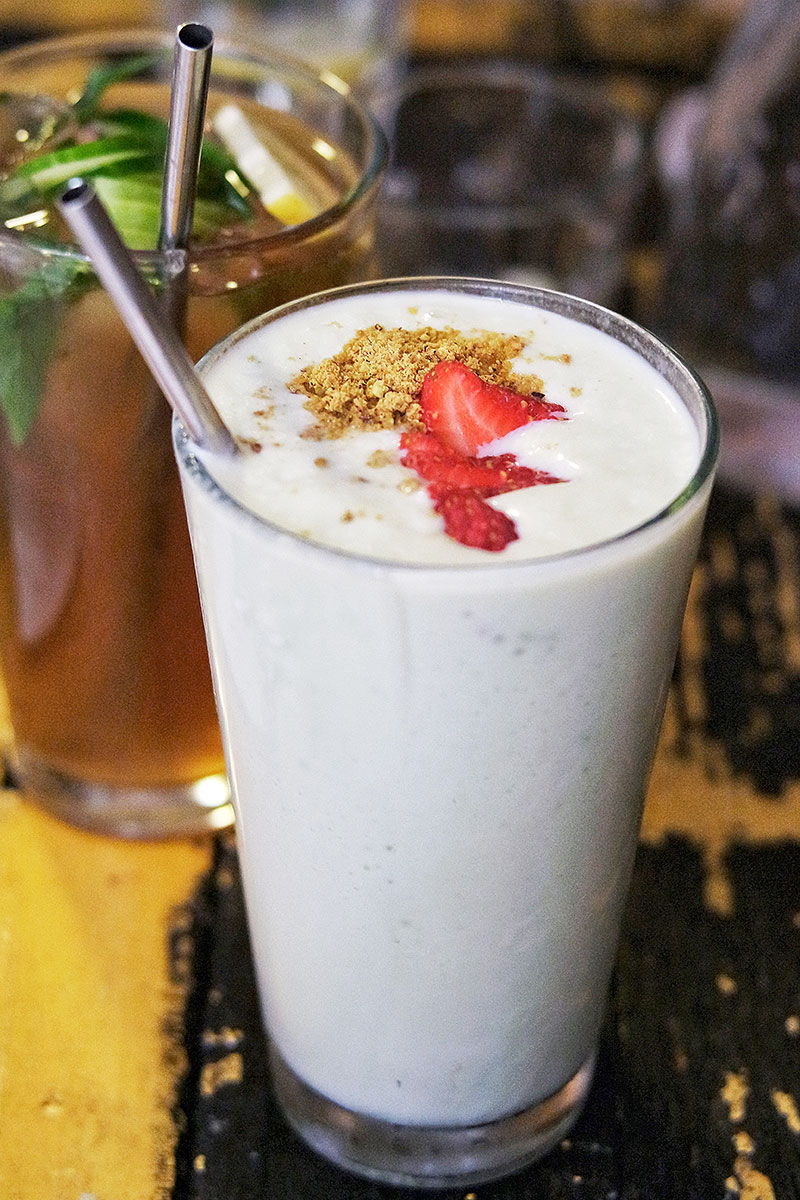 the strawberry cream shake is garnished with a flower