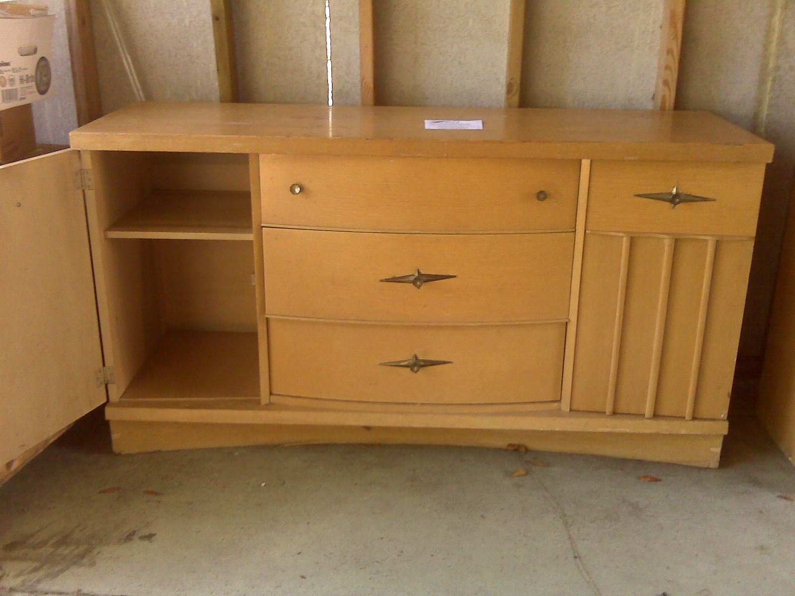 an old style dresser with two shelves, and drawers underneath