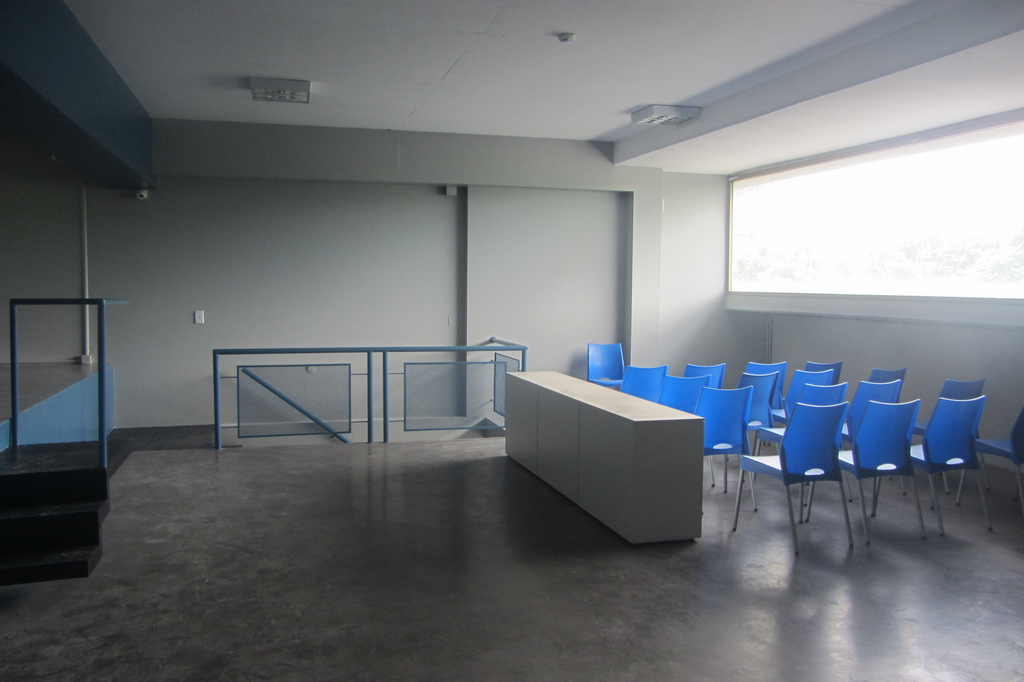a waiting area for a conference or meeting with many chairs
