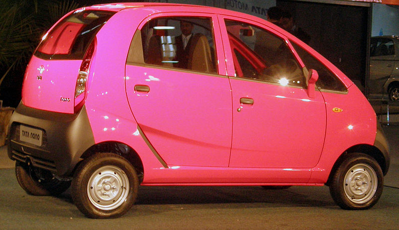 the small car is pink and gray in color