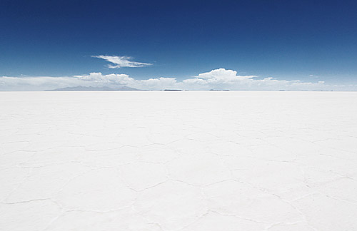 the vast expanse of white sand with blue skies