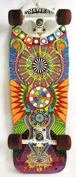 an intricate painted skateboard hangs on the wall