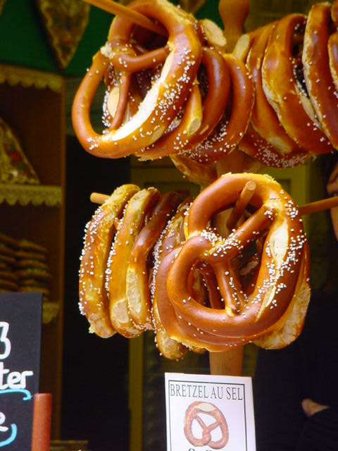 several pretzel hangs in between them at an amut fair
