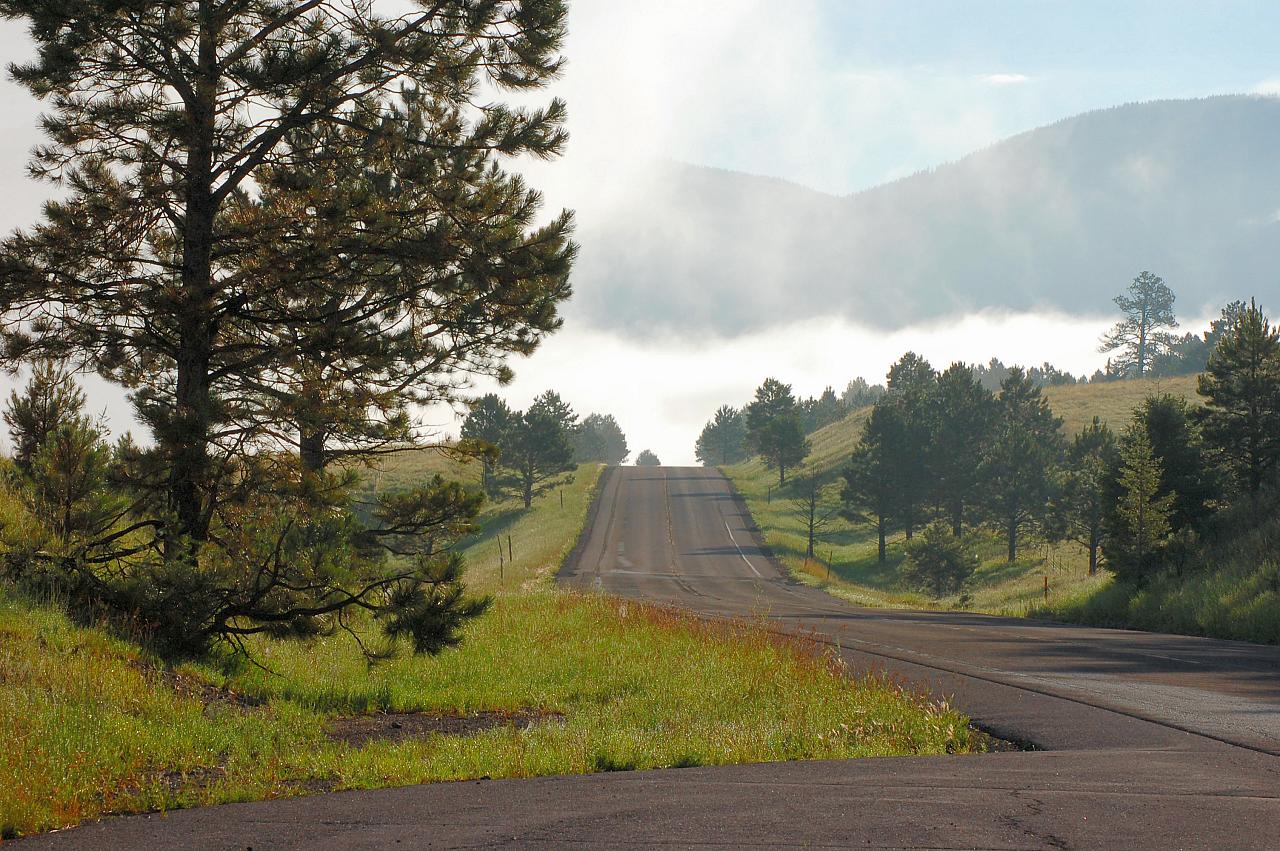 a long empty road with no cars on it