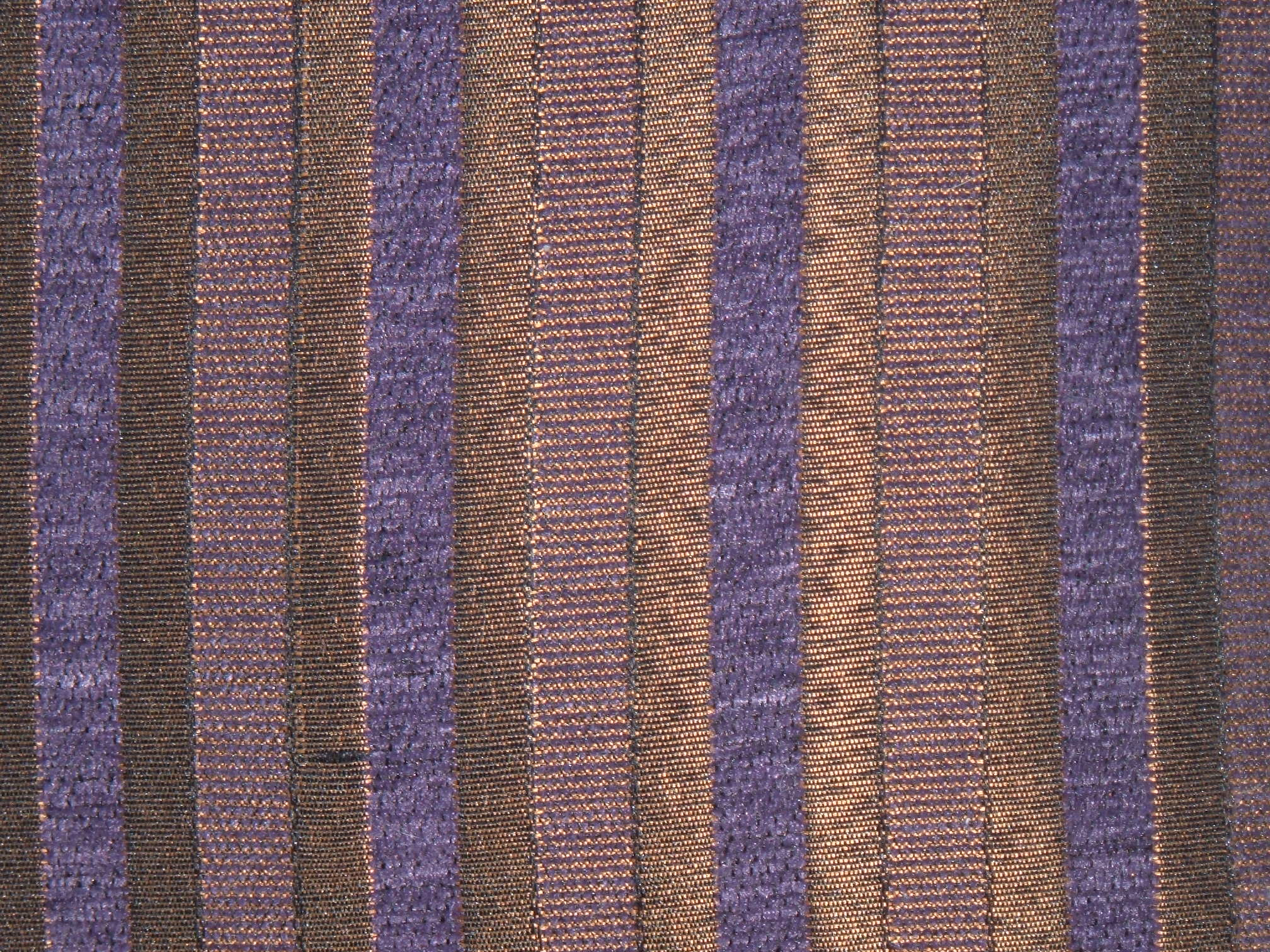 a close up s of a brown and purple striped curtain