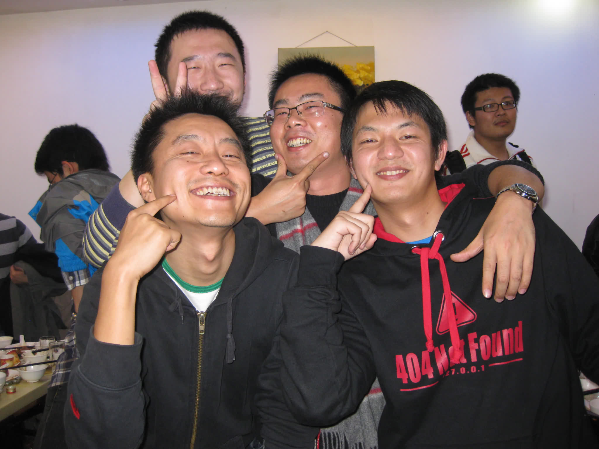 a group of young people are smiling together