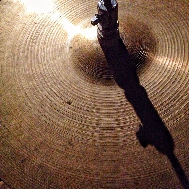 a close up image of a drum head and a shadow