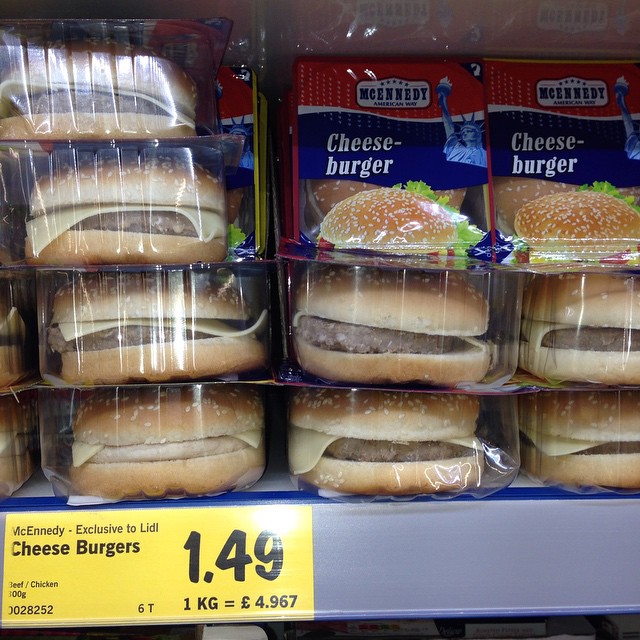 a display in a grocery store that has cheeseburger