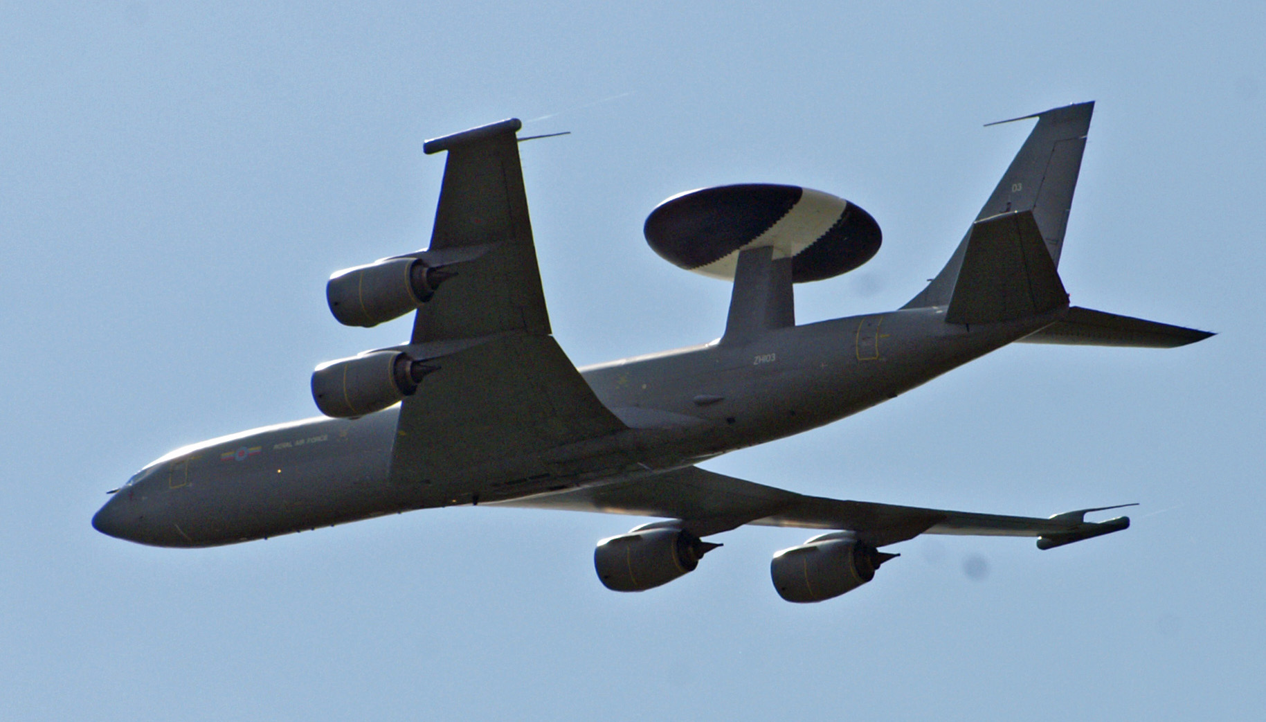 a large commercial airplane is flying overhead in the sky