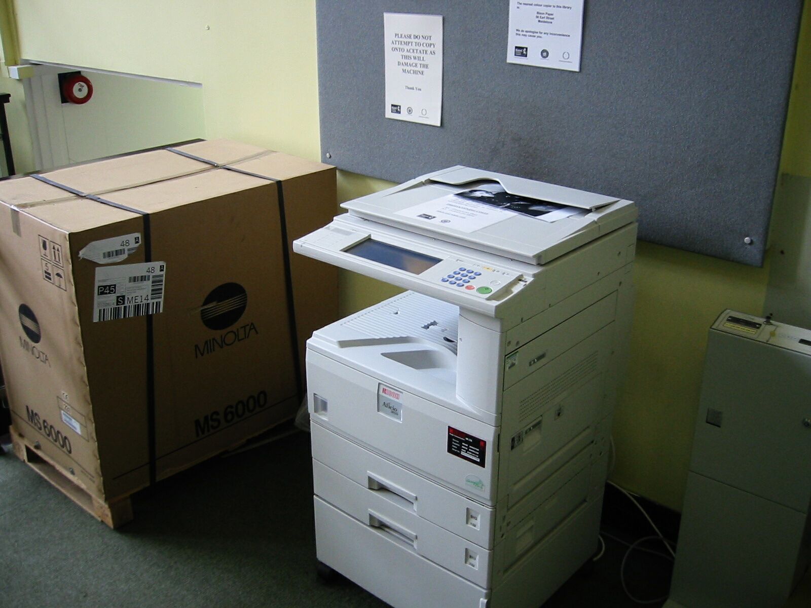 three boxes with some type of paper machines