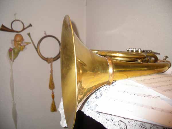 a ss musical instrument next to a musical sheet