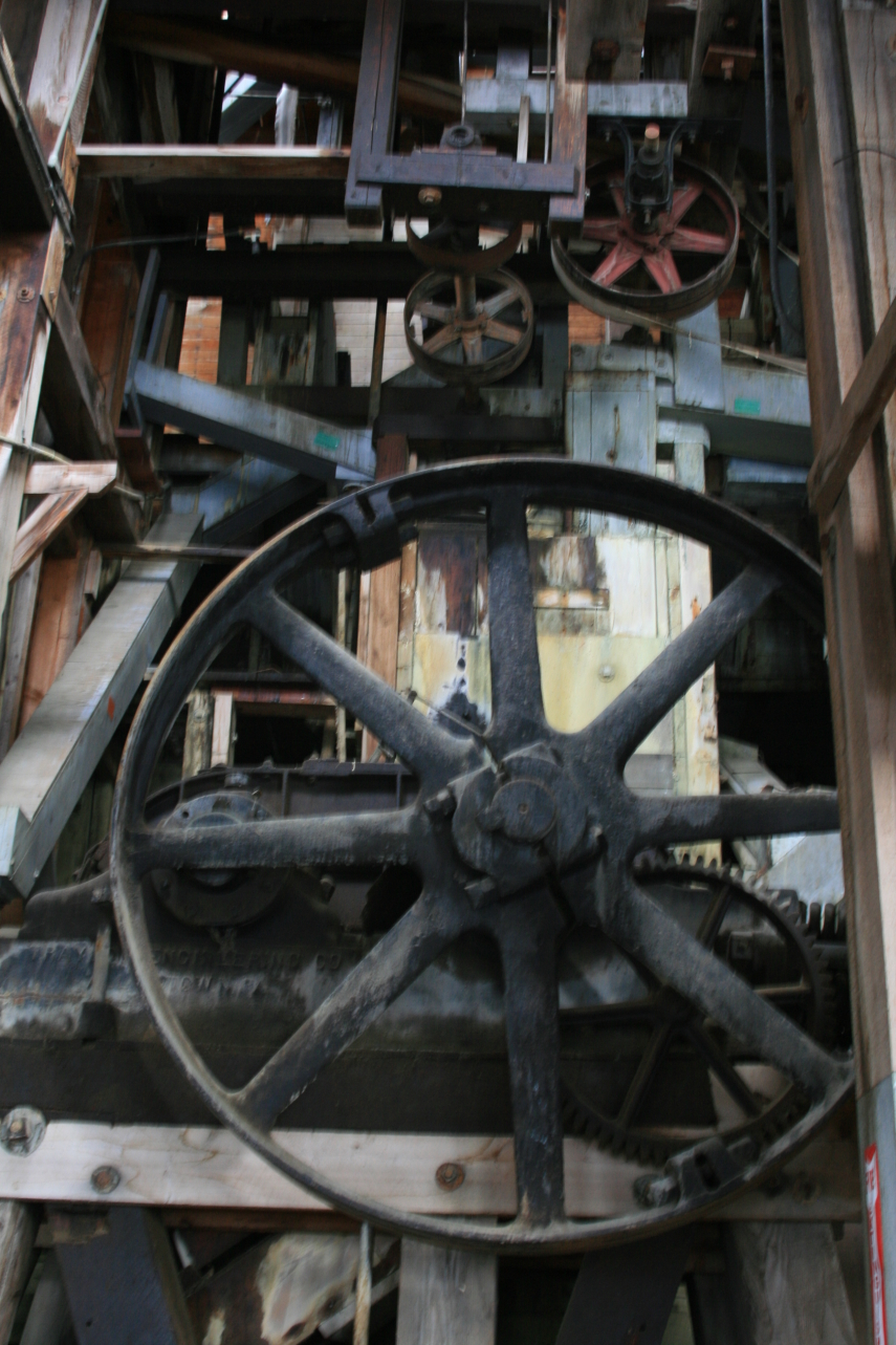 an old, worn and broken machine has spokes