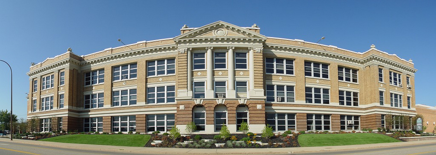 an old building sits near the street in a town