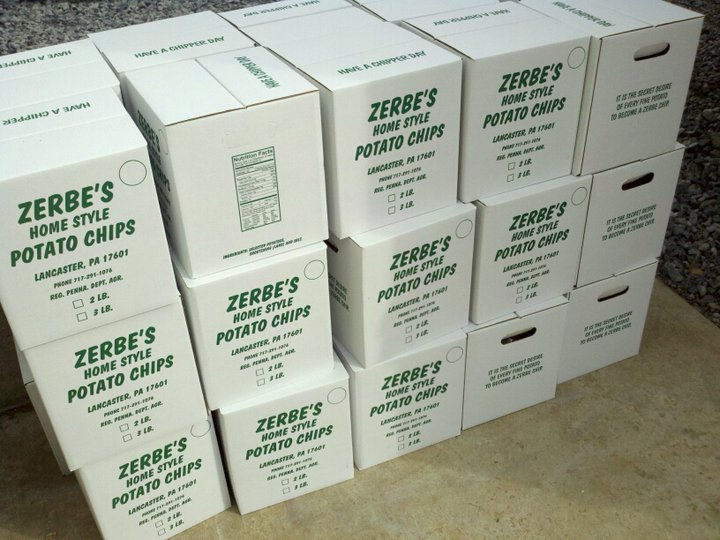 a pile of pizza boxes stacked together