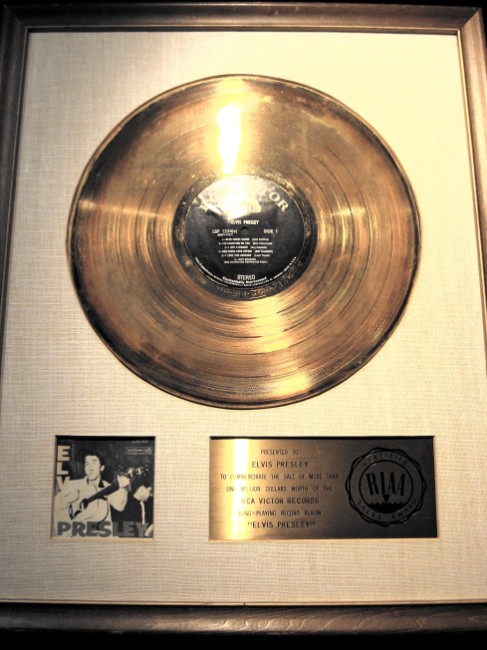an empty golden record in a gold frame