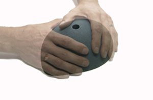 two hands holding an object together in the air