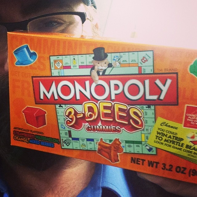 man showing up a monopoly board game