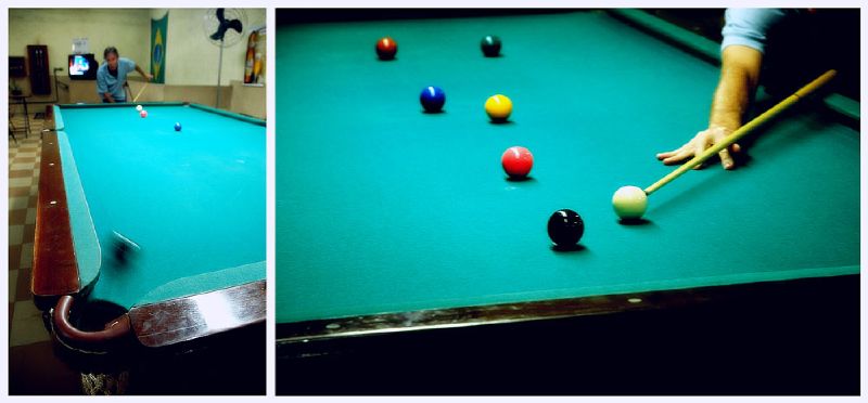 a green pool table with several colorful bill balls