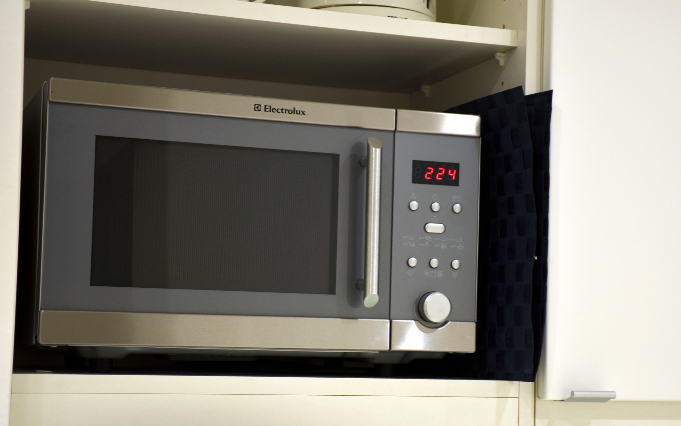 an open microwave oven with the door open